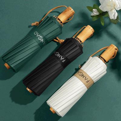 China Modern Custom Luxury Portable Rain Umbrellas Vintage Custom Logo Anti UV Windproof Three-fold Wooden Handle Umbrella for sale