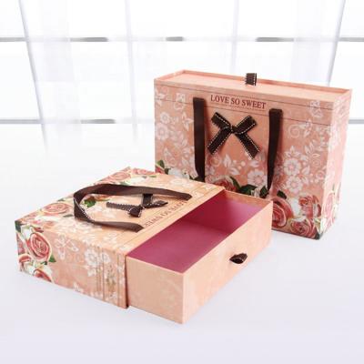 China Recycled Custom Logo Drawer Gift Box With Cardboard Materials Holiday Pink Wedding Box Packaging Handle for sale