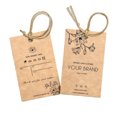 China Anti-Counterfeit Clothing Tags Clothing Hang Tag Custom Clothing Brand Kraft Paper Eco-friendly Paper Jeans Tag for sale