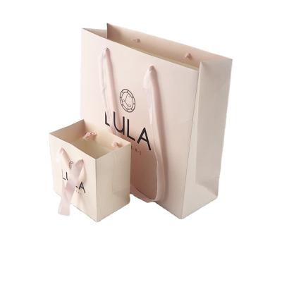 China Custom Logo Materials Recycled Craft Paper Craft Boutique Paper Luxury Brown Gift Bag Packaging Small Shopping Paper Bags With Ribbon Handle for sale