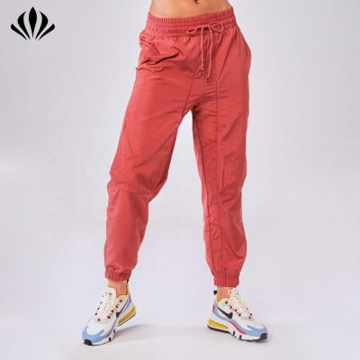 China 100%Polyester Women's Viable Hot Selling Track Pants Lightweight Running Sportswear Comfortable Woven Pants Cargo Pants With Side Pockets for sale