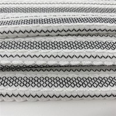 China Good Materials Shrink-Resistant 100% Polyester Knit Brocade Fabric White Jacquard For Dresses for sale