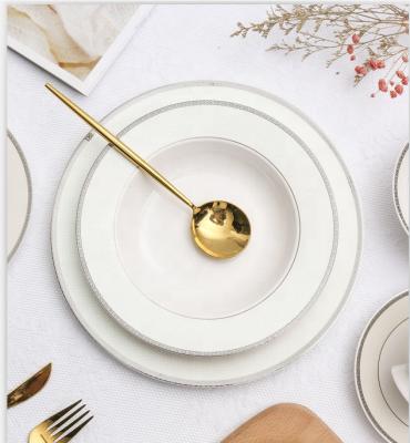 China Viable Luxury Dishes Gold 125Pcs Porcelain Dinnerware Set Embossed Decal White Porcelain Dishes Ceramic Dinner Set for sale