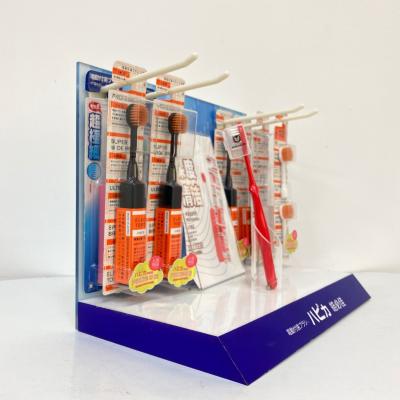 China Acrylic electric toothbrush counter display stand for retail store with graphic 210722-01 for sale