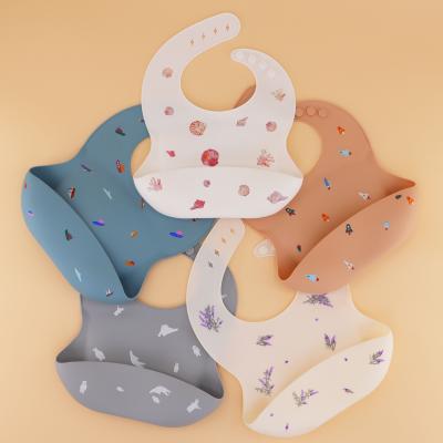 China new arrival silicone food guard 100% silicone printing bibs soft waterproof BPA free baby bibs printed silicone for sale