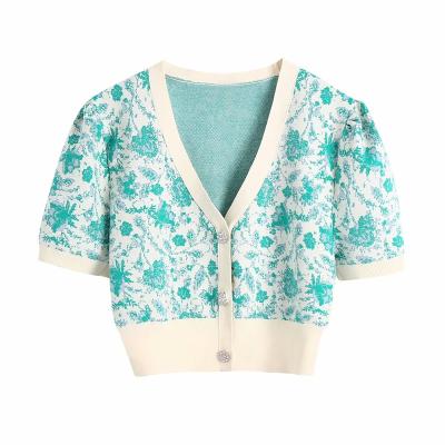 China Anti-wrinkle spring kintwear short sleeve flower jacquard color block pattern women casual V-neck cardigan sweater with button for sale