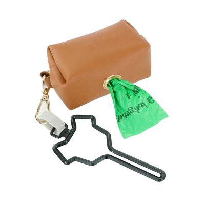 China PU Dog Poop Bag Sustainable Pet Poop Bag Holder Leather Poop Bag Holder With Carabiner Clip for sale