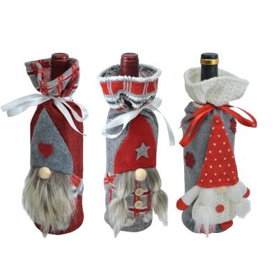 China Non-woven fabrics the 2022 new Christmas decoration wine bottle set minions ornament the minions Jurassic Christmas Christmas pyroar plush for sale