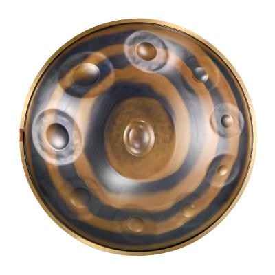 China Copper-bearing jingle-Spirl A-10 steel gold plated professional steel tongue drum hand pan handpan made at professional musical instruments factory for sale