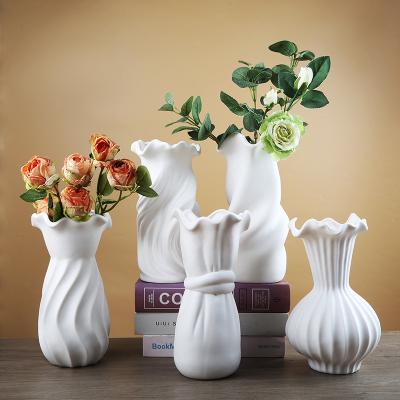 China Modern creative simple line good design of fine ceramic simple elegant white ceramic ornament tall vase for home decorations for sale