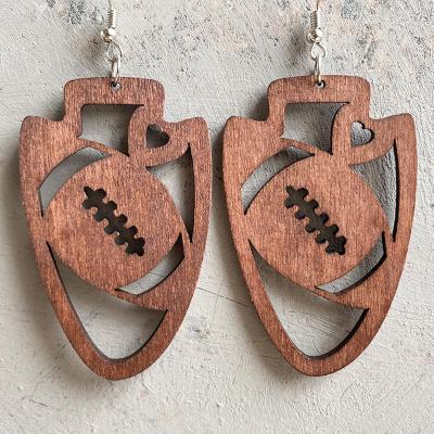 China Creative Handmade Hollow Wooden Vintage Exaggeration Women's Rugby New Carved Wooden Dangle Earrings for sale