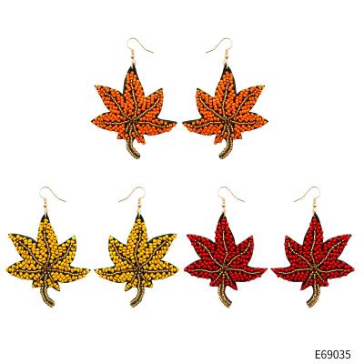 China Vintage 2022 Autumn Harvest Festival Hand Woven Maple Leaf Shaped Earrings For Women Retro Ethnic Style Seed Beads Dangle Hook Earrings for sale