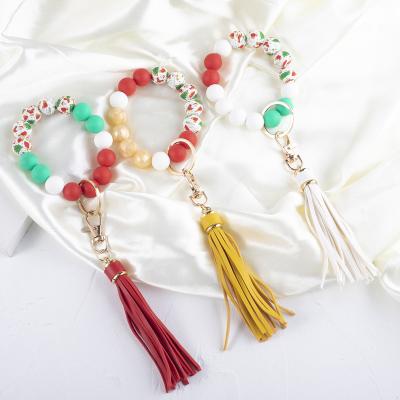 China Silicone Beads Key Chain Pendant Leather Key Ring For Women Fashion Bag Tassel Bracelet Santa Print Silicone Beaded Bracelet Beautiful Christmas for sale