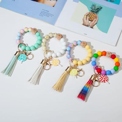 China Silicone Beads Candy Colored Silicone Beaded Bracelet Key Chain With Color Pendant For Women Leather Link Dye Leopard Tassel Bracelet Key Chain for sale