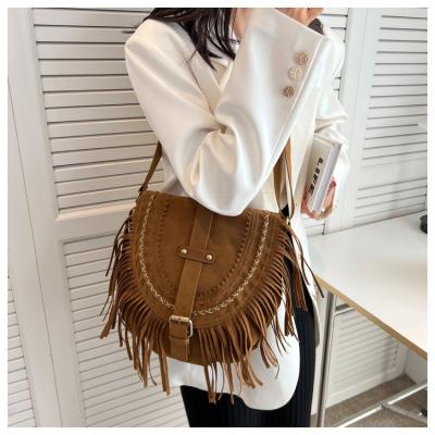 China South Korea 2022 retro fashion portable women's multi functional shoulder cross bag one of new suede original fringe bag for sale