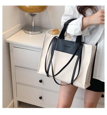 China Retro Portable Women PU Shoulder Body Large Capacity Cross Tote Bag One Color Textured Leather Portable Contrast Fashion Canvas for sale