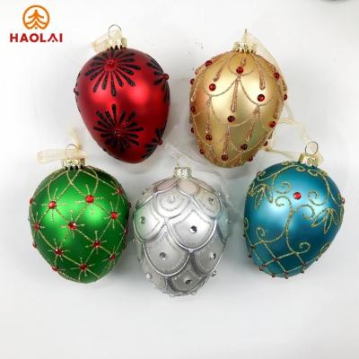 China Christmas tree ornament 2023 Christmas Decoration 8cm painted Christmas glass egg shape exquisite gift Christmas tree decoration pendant for sale