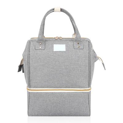 China Bolso de pañales Mochila de viaje inalámbrica grande bolsos de bebé gris clásico cuerpo cruzado 10X7X13