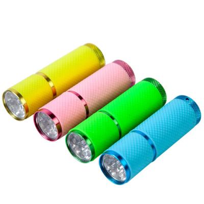 China Emergency Glow In The Dark 9 LED Flashlights Portable Mini Fluorescent Glow In The Aluminum Handy Rubber Coated Torch for sale