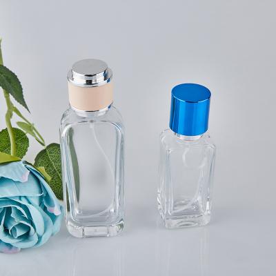 China Cosmetic Glass Perfume Bottle 30ml 50ml Clear Thick Bottom Perfume Bottle With Color Cap for sale