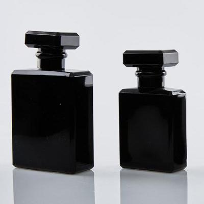 China Wholesale Cosmetic Luminous Black Flat Perfume Bottle 20ml 30ml 50ml 100ml Shoulder Pump Spray Glass With Unique Lid for sale