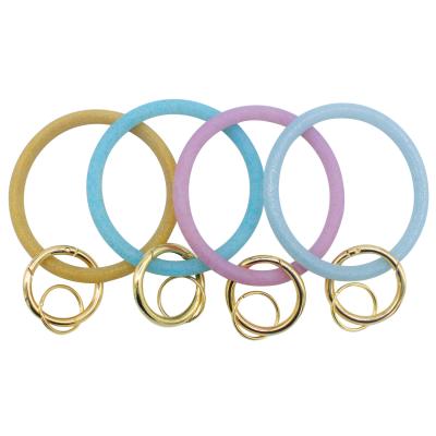 China Stocked Ring Women Key Chain Holder Charm Key Chain Wristband Silicone Wristband Keychain Sports Wristband Promotional Key Bracelets for sale