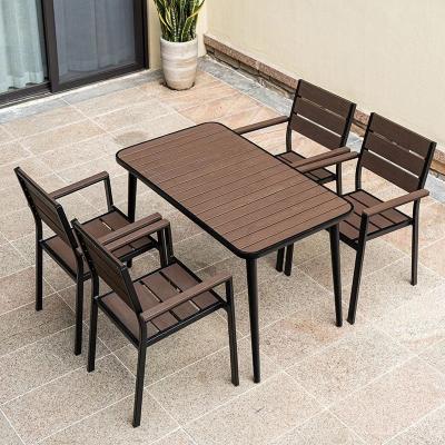 China Contemporary Plastic Wood Table Top Metal Aluminum Dining Set for 4 Seats for sale