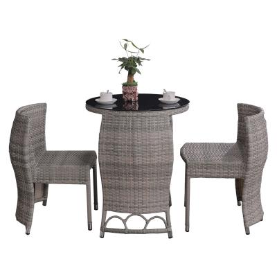 China Can be closed creative design outdoor rattan dining table and chairs furniture set with sight tempered glass for sale