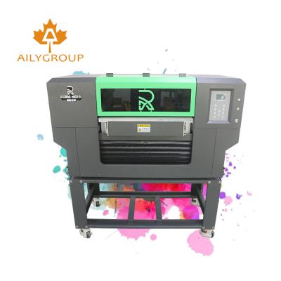 China Industrial indoor outdoor advertising all materials best 6040 3 head led uv printer dx5 dx7 head digital inkjet printer for cartoon canvas for sale