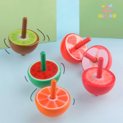 China Fun Wooden Toddler Relaxation Education Kids First Fruit Trains Wiggle Person Toys Set Spinning Top Toy Game for sale