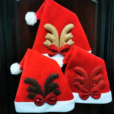 China Durable Hot Selling Red Christmas Decorating Hats Merry Christmas Adults Kids Antlers Christmas Hat for sale