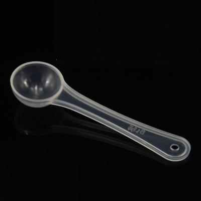 China Viable Wholesale Clear Plastic Scoop 2ml Salt Spice Powder Measuring Spoon 1gram for sale