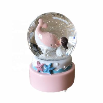 China Europe Pink Color Souvenir Glitter Water Ball Resin Dolphin Snow Globe for sale