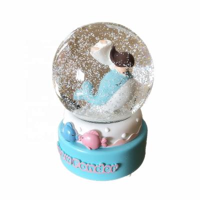 China Europe Glitter Snowflake Water Ball Resin Dolphin Snow Globe for sale