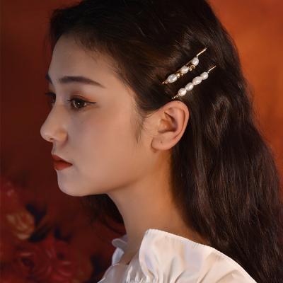 China ALLOY Irregular Natural Baroque Hairpin Shaped Real Pearl French Side Word Clip Real Pearl Niche Design Retro Hair Clip for sale