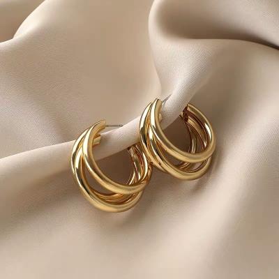 China 925 FASHIONABLE silver needle European and American fashion retro temperament metal three ring metal trend net red c-shaped earrings for sale