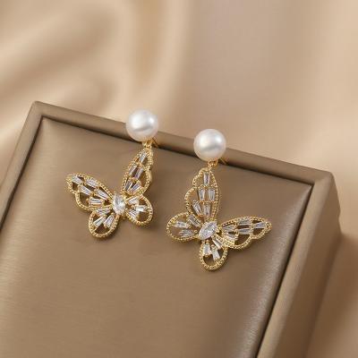 China FASHIONABLE female simple temperament natural pearl minority earrings butterfly design hollow butterfly design soft silver earr S925 earr for sale