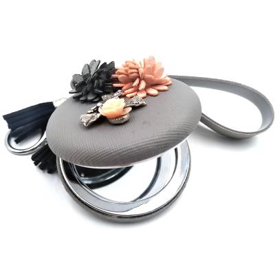 China Souvenir Gifts Promotion Woman's Hand Round Compact Makeup Mirror Key Chain With Tassel for sale