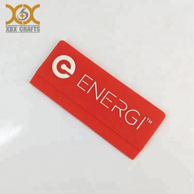 China Sustainable Custom Plastic Garment Brand Label Apparel PVC Logo Label for sale