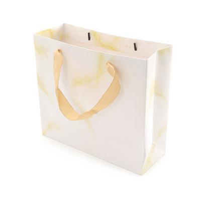 China Recyclable Oil Laminated Flower Gift Paper Bags With Handles Design Bags Floral Custom Paper for sale