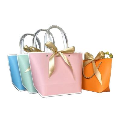 China Recyclable Customized Recyclable Paper Bags For Clothing Store Clothing Kids Packaging Mini Garment Bag for sale