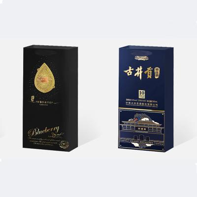 China Recyclable Customized Paper Liquor Bags With Logo Holiday Wine Bottle Merchandise Bag For Christmas for sale