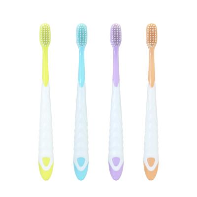 China Manual Popular Children's Toothbrush Anti Slip Soft Bristle Toothbrush Baby 3-12 Years Old for sale