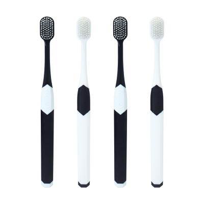 China Best Selling Black And White Soft OEM Manual Bristle Cheap Wide Torque Adult Toothbrush Head Bristle for sale