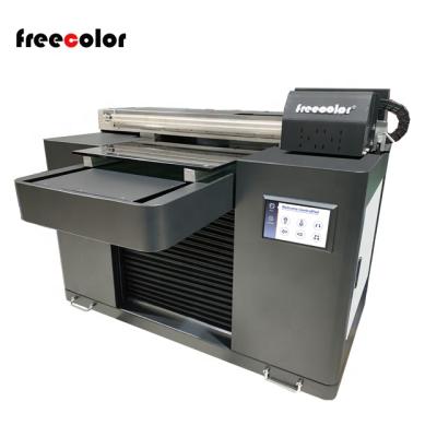 China Indoor Outdoor Advertising A2 Plus UV Flatbed Printer With 40cm Printing Size for sale