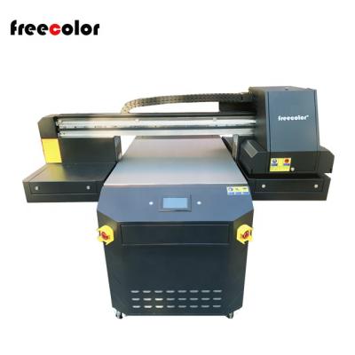 China Hotels Freecolor 60*90cm Size UV ​​Printer Fast Speed ​​FC-UV6090 Flatbed Printer with 2 or 3 head printing machine for sale