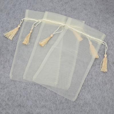 China Gift Wholesale 15x28cm Nylon Mesh Drawstring Package Bag Organza Gift Pouch Bags With Tassel for sale