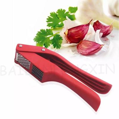 China Viable Manual Garlic Press Kitchen Accessories 2 in 1 Garlic Press Ginger Chopper Garlic Press Crusher for sale