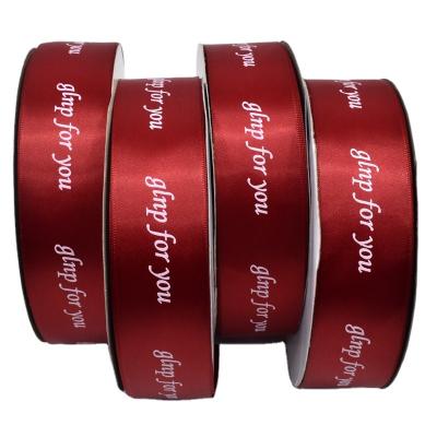 China Sustainable Manufacturers Custom 4cm Wine Red Polyester With Printed Text Ribbon Apparel Bow Wrapping Ribbon for sale