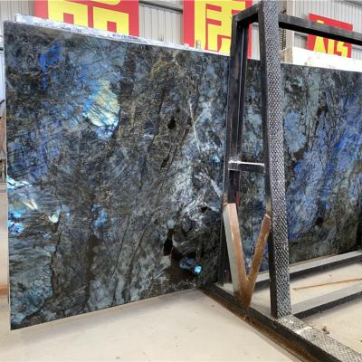 China Modern Exotic Blue Labradorite Slab Granite Lemurian Blue Granite For Indoor Luxury Counter Table Tops for sale